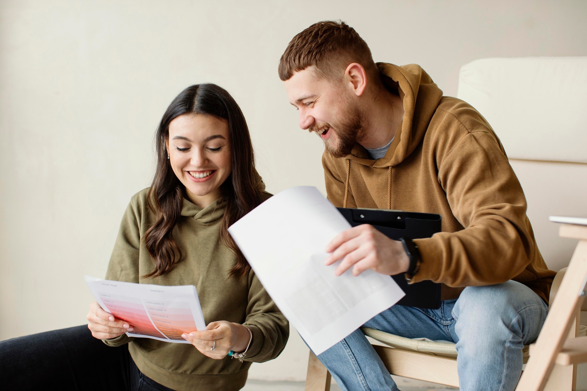 HomeGo Reviews: Comprehensive Analysis and Alternatives medium shot couple holding plans